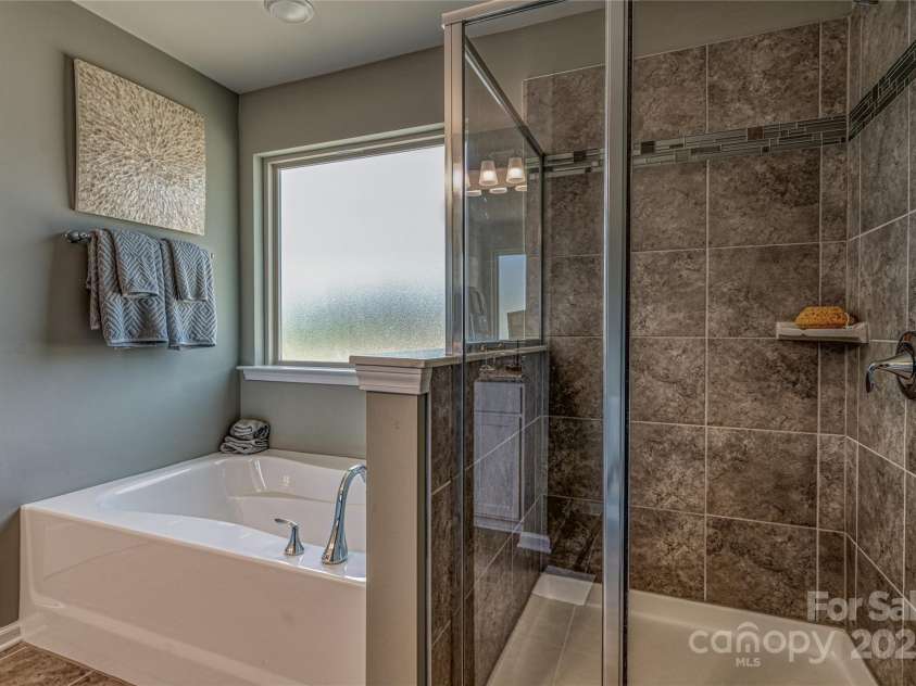 247 Tackle Box Drive, Troutman, NC 28166.  MLS# CAR4250227, YatesRealty ID 20892. Primary Bath with separate tub and shower
