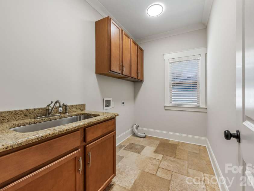 3400 Holt Street, Charlotte, NC 28205.  MLS# CAR4373235, YatesRealty ID 20892. Second level laundry room