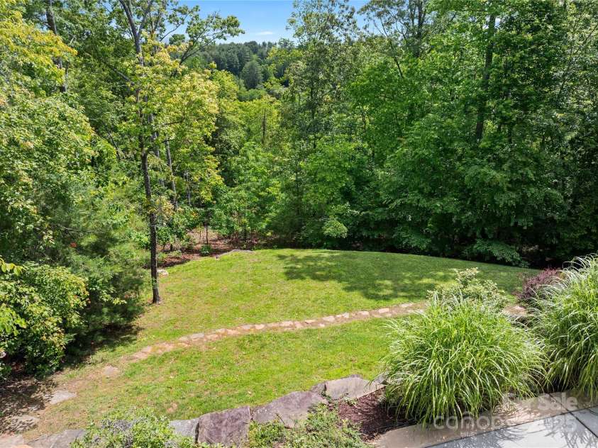 14 Sweet Gum Hill, Fletcher, NC 28732.  MLS# CAR4249700, YatesRealty ID 20898. Sunny open lower yard space