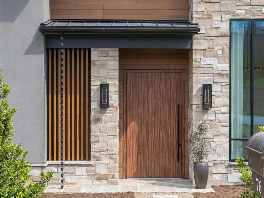 76 Running Creek Trail, Arden, NC 28704.  MLS# CAR4364123, YatesRealty ID 20900. Modern wood pivot front door.