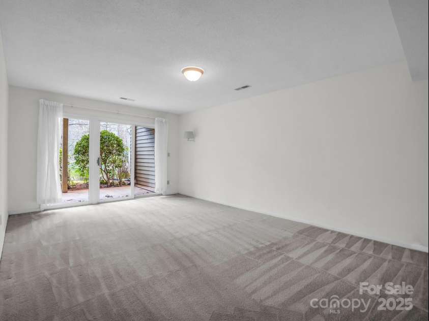 31 Hunting Country Trail, Tryon, NC 28782.  MLS# CAR4240091, YatesRealty ID 20903. Bedroom in Basement.