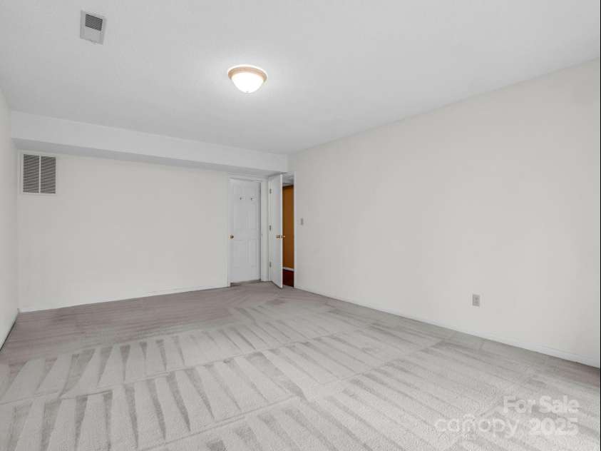 31 Hunting Country Trail, Tryon, NC 28782.  MLS# CAR4240091, YatesRealty ID 20903. Bedroom in basement