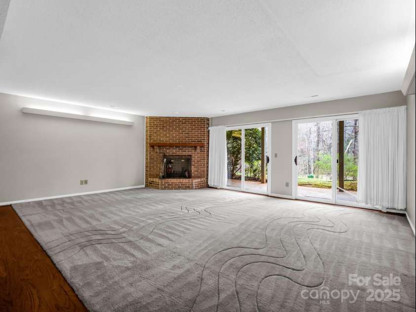 31 Hunting Country Trail, Tryon, NC 28782.  MLS# CAR4240091, YatesRealty ID 20903. Den in Basement!