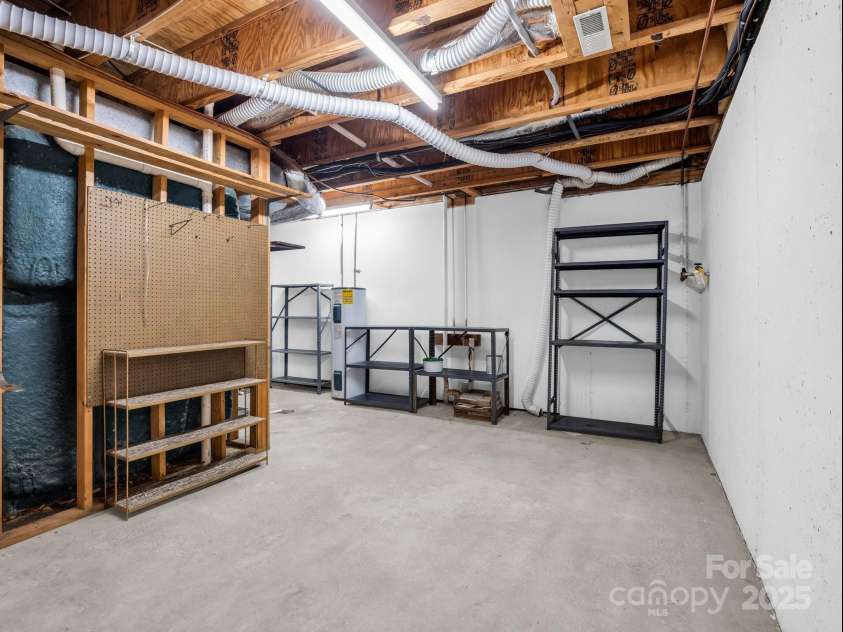 31 Hunting Country Trail, Tryon, NC 28782.  MLS# CAR4240091, YatesRealty ID 20903. Work shop and/or storage area in basement.