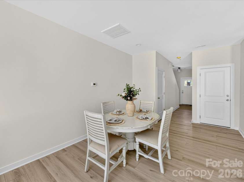 655 Stillgreen Lane, Charlotte, NC 28214.  MLS# CAR4358082, YatesRealty ID 20904. Open-concept kitchen flows seamlessly into a bright breakfast nook and living area, creating an inviting space ideal for both everyday dining and entertaining.