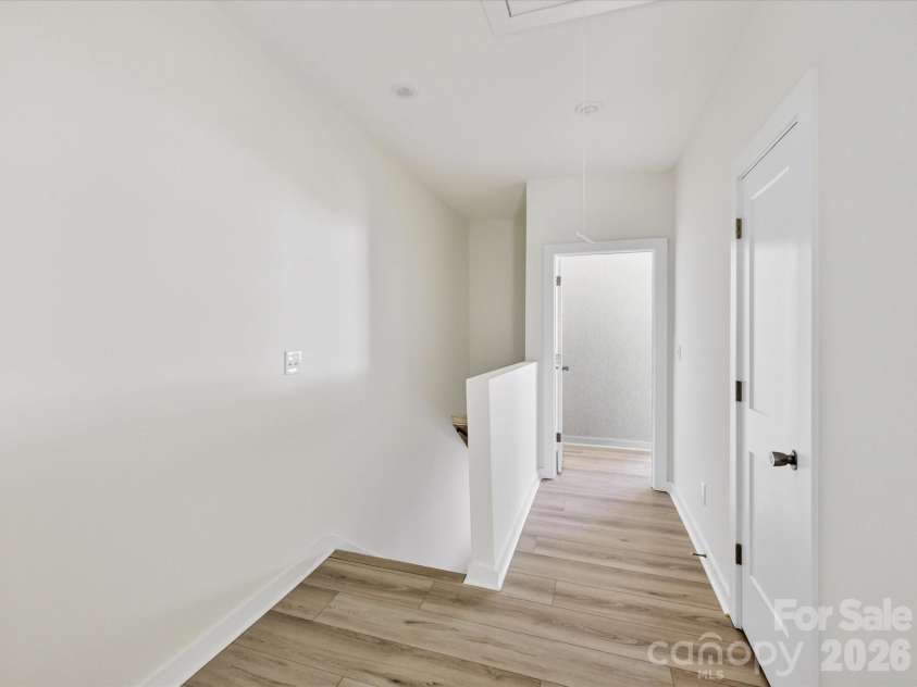 655 Stillgreen Lane, Charlotte, NC 28214.  MLS# CAR4358082, YatesRealty ID 20904. Spacious upper-level landing with clean finishes and versatile space ideal for a small workspace, reading nook, or added functionality.