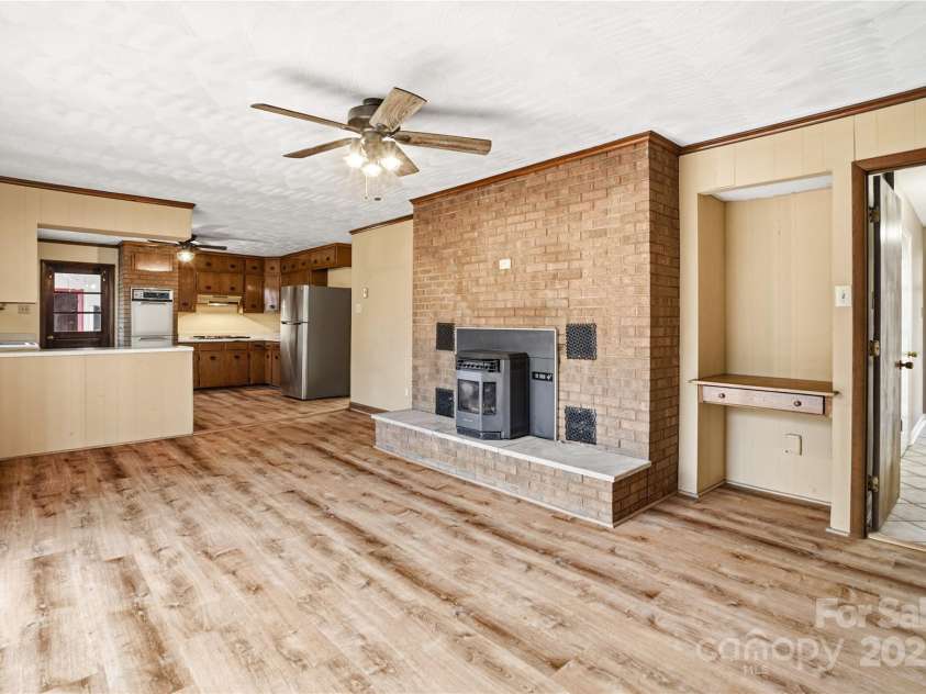 2619 Hopewell Church Road, Sherrills Ford, NC 28673.  MLS# CAR4265772, YatesRealty ID 2091. Bright living area with fresh LVP flooring and cozy atmosphere, flowing seamlessly into the kitchen, featuring a built-in desk for work or study.