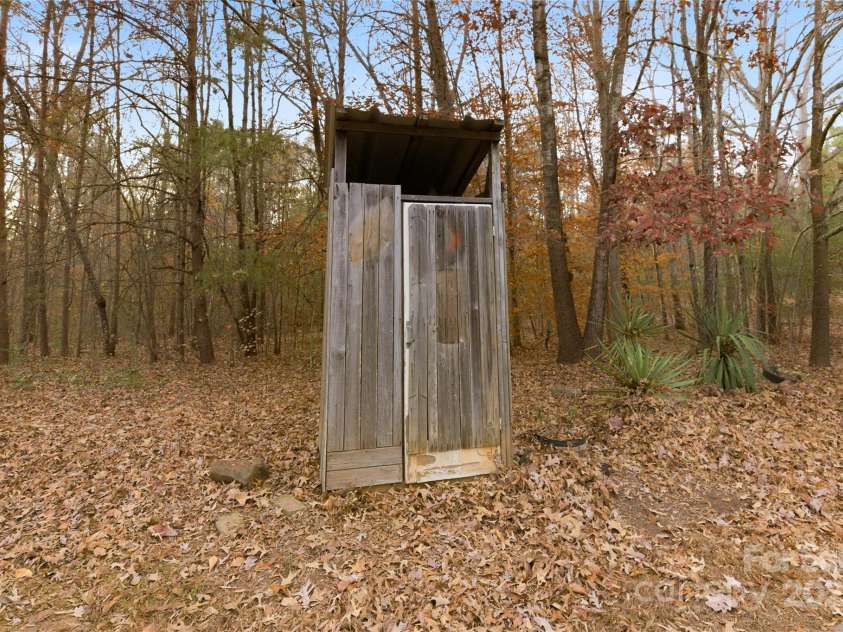 2619 Hopewell Church Road, Sherrills Ford, NC 28673.  MLS# CAR4265772, YatesRealty ID 2091. Classic outhouse adds character and a touch of rustic charm to the property.