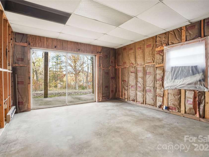 2619 Hopewell Church Road, Sherrills Ford, NC 28673.  MLS# CAR4265772, YatesRealty ID 2091. Fourth bedroom downstairs with patio access, offering flexibility for guests, family, or work space.