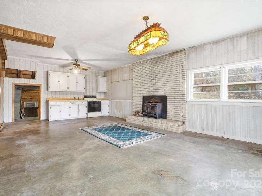 2619 Hopewell Church Road, Sherrills Ford, NC 28673.  MLS# CAR4265772, YatesRealty ID 2091. Functional downstairs kitchen with potential to create a second living quarters, providing flexibility and room for renovation or entertaining.