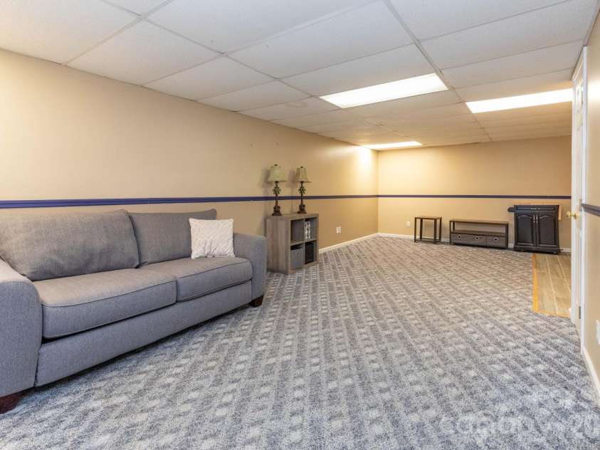 6 Arrowhead Lane, Weaverville, NC 28787.  MLS# CAR4363937, YatesRealty ID 20910. Basement Studio Living Space