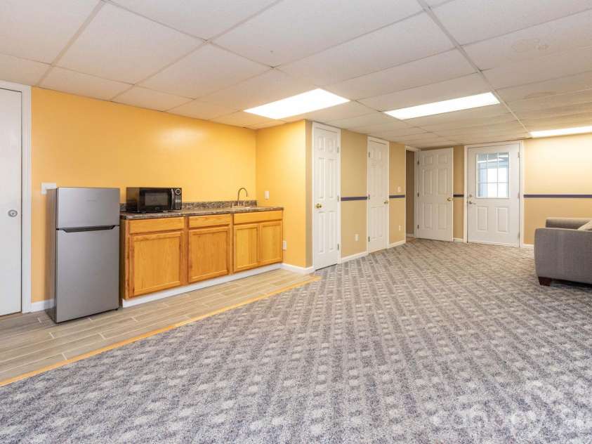 6 Arrowhead Lane, Weaverville, NC 28787.  MLS# CAR4363937, YatesRealty ID 20910. Basement Studio Living Space