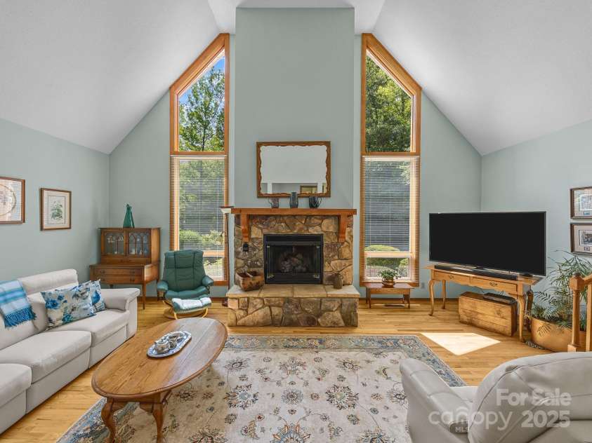 266 Case Street, Columbus, NC 28722.  MLS# CAR4265986, YatesRealty ID 20911. Bright Living Room with gas log fireplace that could be converted back to wood.