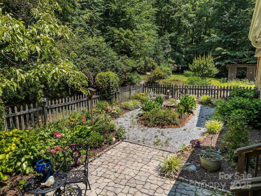 266 Case Street, Columbus, NC 28722.  MLS# CAR4265986, YatesRealty ID 20911. Easy care flower beds off patio.