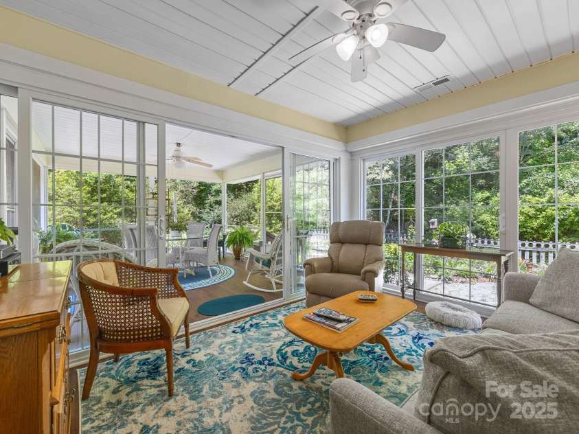266 Case Street, Columbus, NC 28722.  MLS# CAR4265986, YatesRealty ID 20911. Inviting Sunroom opens to Screened Porch!