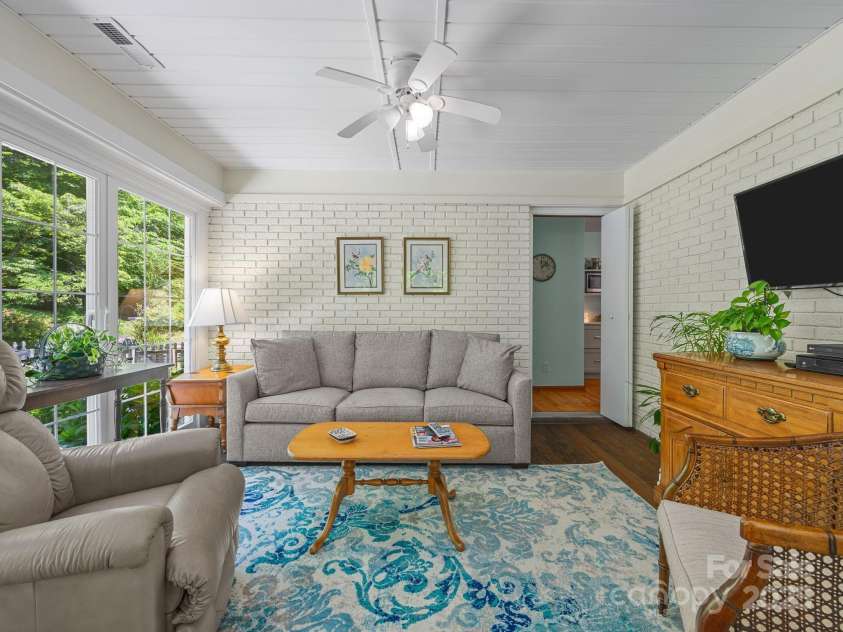 266 Case Street, Columbus, NC 28722.  MLS# CAR4265986, YatesRealty ID 20911. Sunroom is just off the kitchen and Primary bathroom.