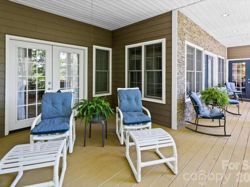 1307 Golf Course Road, Old Fort, NC 28762.  MLS# CAR4372492, YatesRealty ID 20912. Front deck with doors to living, dining, and flex rooms
