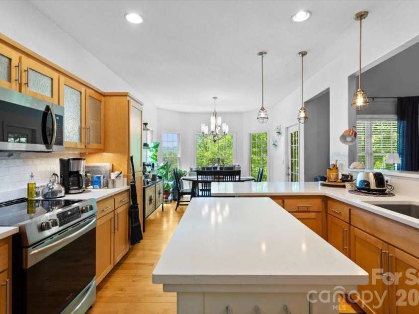 1307 Golf Course Road, Old Fort, NC 28762.  MLS# CAR4372492, YatesRealty ID 20912. Kitchen into the dining area