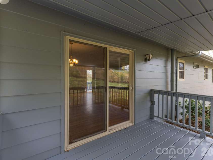 147 Elkwood Road, Asheville, NC 28804.  MLS# CAR4366440, YatesRealty ID 20921. Covered Back Deck