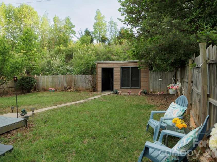 6135 Blue Ash Lane, Charlotte, NC 28215.  MLS# CAR4371813, YatesRealty ID 20922. Welcome to your private paradise, Gardener's Potting Shed in fully fenced in back yard, Fruit trees include Bananas, Peaches and Figs