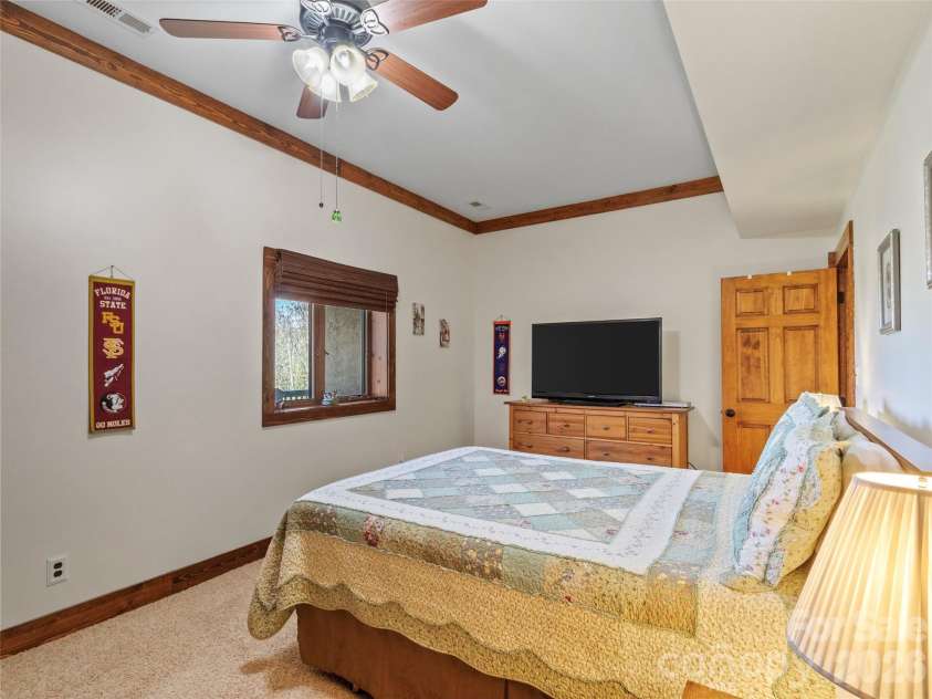 129 Apple Farm Road, Bakersville, NC 28705.  MLS# CAR4375301, YatesRealty ID 20926. Lower level bedroom 