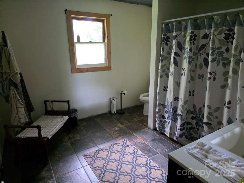 244 Mcmahan Lane, Bakersville, NC 28705.  MLS# CAR4269540, YatesRealty ID 20927. Hall bathroom with ceramic tile flooring