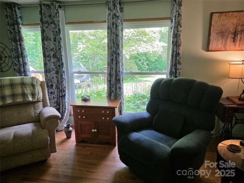 244 Mcmahan Lane, Bakersville, NC 28705.  MLS# CAR4269540, YatesRealty ID 20927. Living room looking out to the driveway