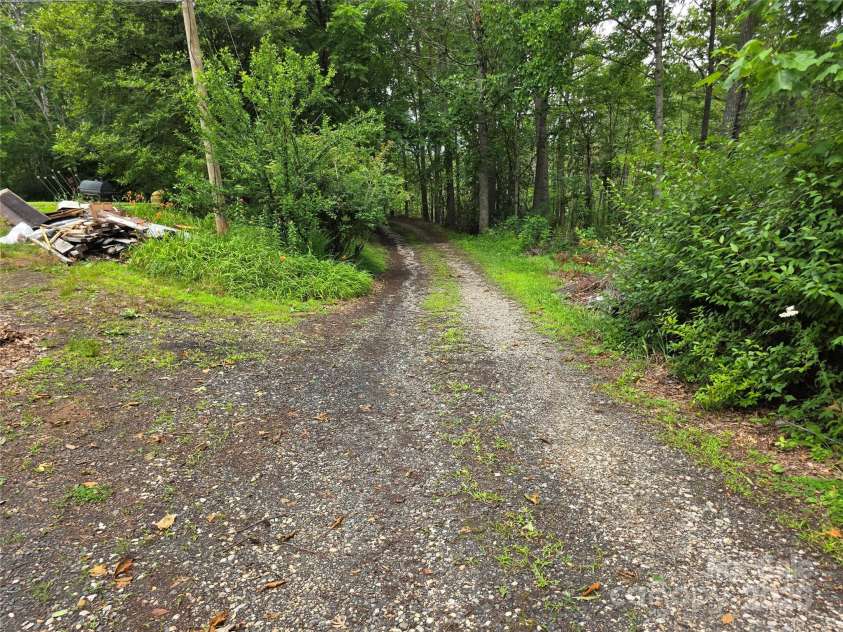 244 Mcmahan Lane, Bakersville, NC 28705.  MLS# CAR4269540, YatesRealty ID 20927. McMahan Lane looking west from eastern edge of property