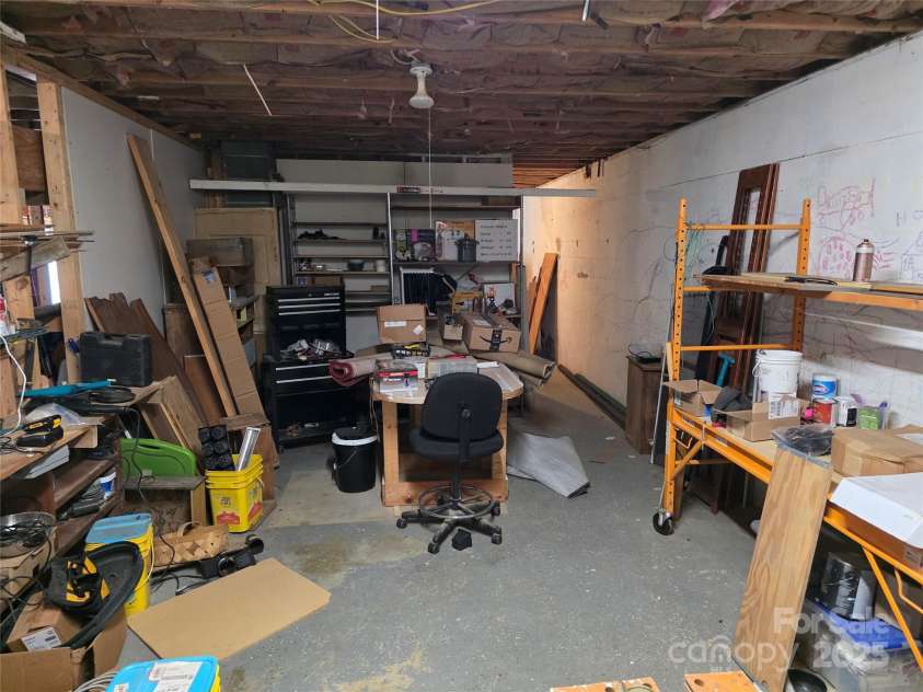 244 Mcmahan Lane, Bakersville, NC 28705.  MLS# CAR4269540, YatesRealty ID 20927. Shop area in the basement