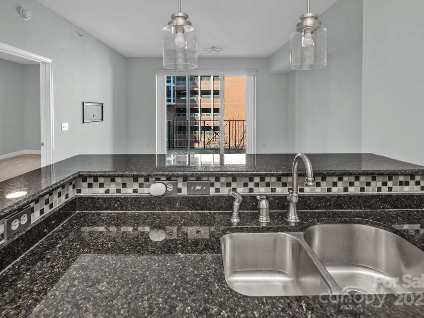 300 5th Street, Charlotte, NC 28202.  MLS# CAR4332845, YatesRealty ID 20929. BR door in view from kitchen