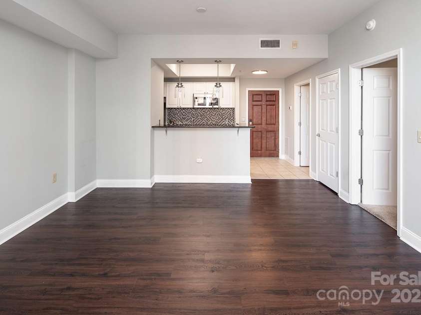 300 5th Street, Charlotte, NC 28202.  MLS# CAR4332845, YatesRealty ID 20929.  BR door in view from LR