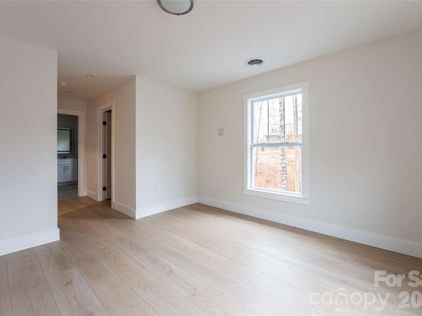 169 Cascade Ridge Road, Fairview, NC 28730.  MLS# CAR4351388, YatesRealty ID 20936. Owner's Bedroom