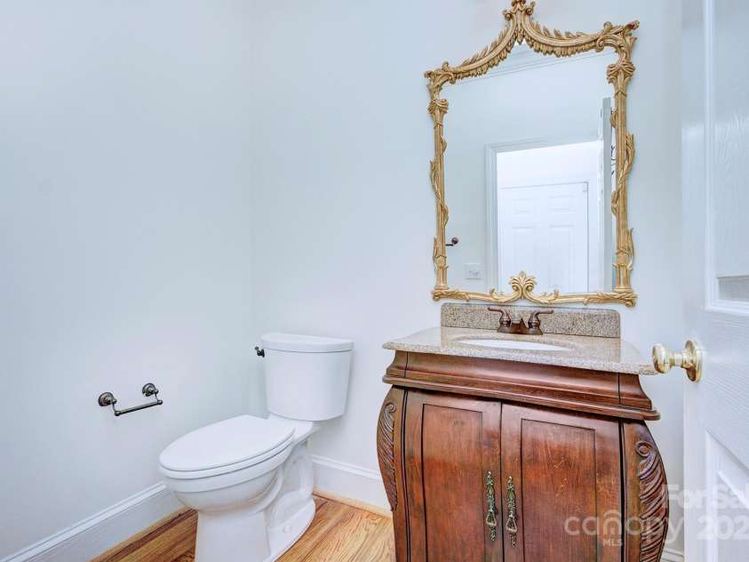 8044 Hawk Crest Court, Charlotte, NC 28270.  MLS# CAR4267919, YatesRealty ID 20940. Main level half bath with vanity sink