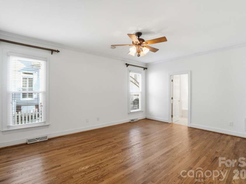 8044 Hawk Crest Court, Charlotte, NC 28270.  MLS# CAR4267919, YatesRealty ID 20940. Main level primary bedroom with hardwood flooring