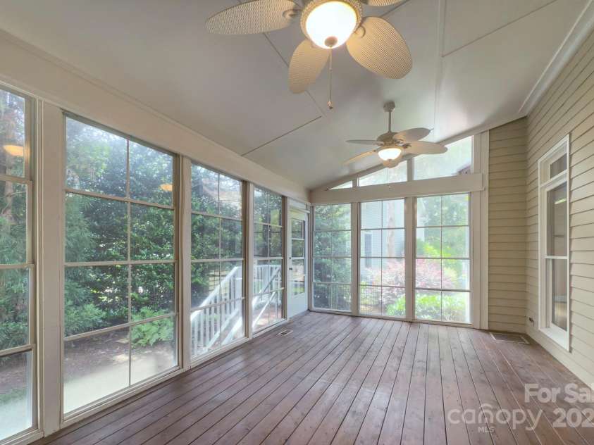 8044 Hawk Crest Court, Charlotte, NC 28270.  MLS# CAR4267919, YatesRealty ID 20940. Screen porch with Eze Breeze style screening system- there is ductwork in this area but it is not included in the overall square footage