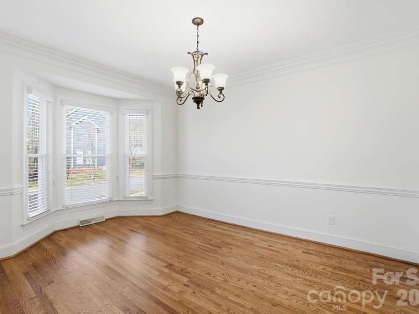 8044 Hawk Crest Court, Charlotte, NC 28270.  MLS# CAR4267919, YatesRealty ID 20940. Spacious formal dining room with bay window, hardwood floors and neutral paint