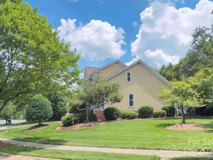 8044 Hawk Crest Court, Charlotte, NC 28270.  MLS# CAR4267919, YatesRealty ID 20940. The Lot goes to the treeline on right side of property - there is landscape up-lighting across the front