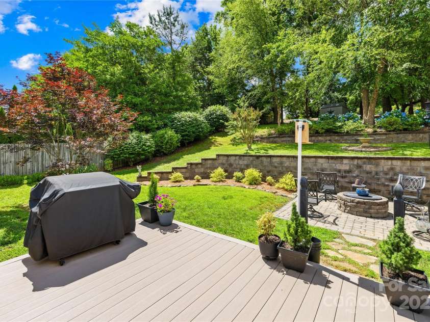 4313 Wynborough Lane, Charlotte, NC 28269.  MLS# CAR4271807, YatesRealty ID 20945. Backyard is a special place for this family, lots of happy memories made here.