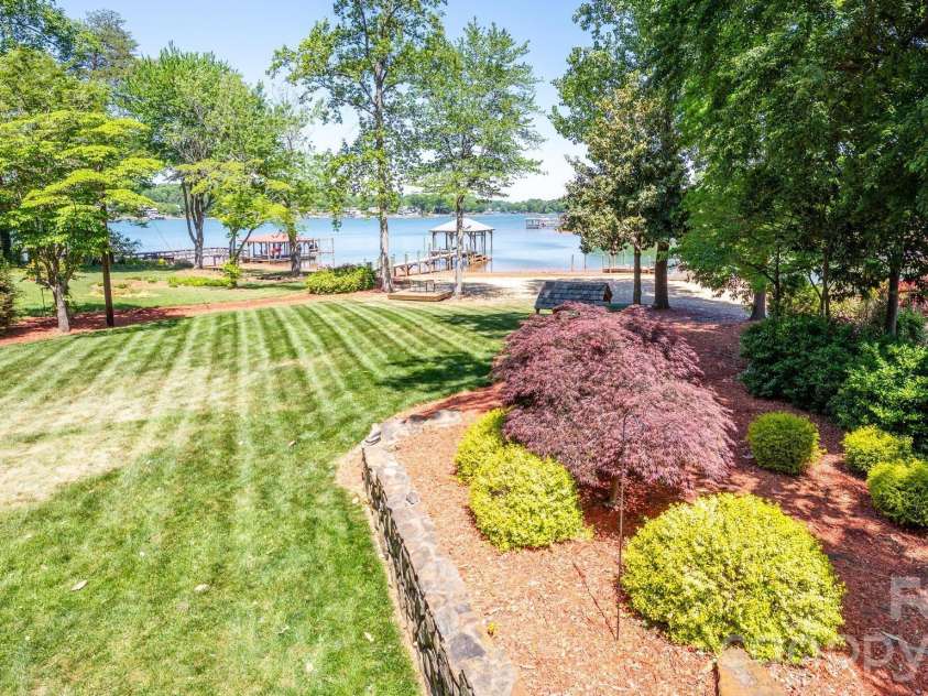 170 Malibu Road, Mooresville, NC 28117.  MLS# CAR4372531, YatesRealty ID 20948. Level Backyard