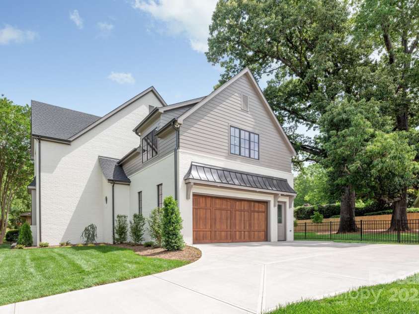 5124 Lansing Drive, Charlotte, NC 28270.  MLS# CAR4231364, YatesRealty ID 20951. Attached 2-car garage with custom cedar garage door.
