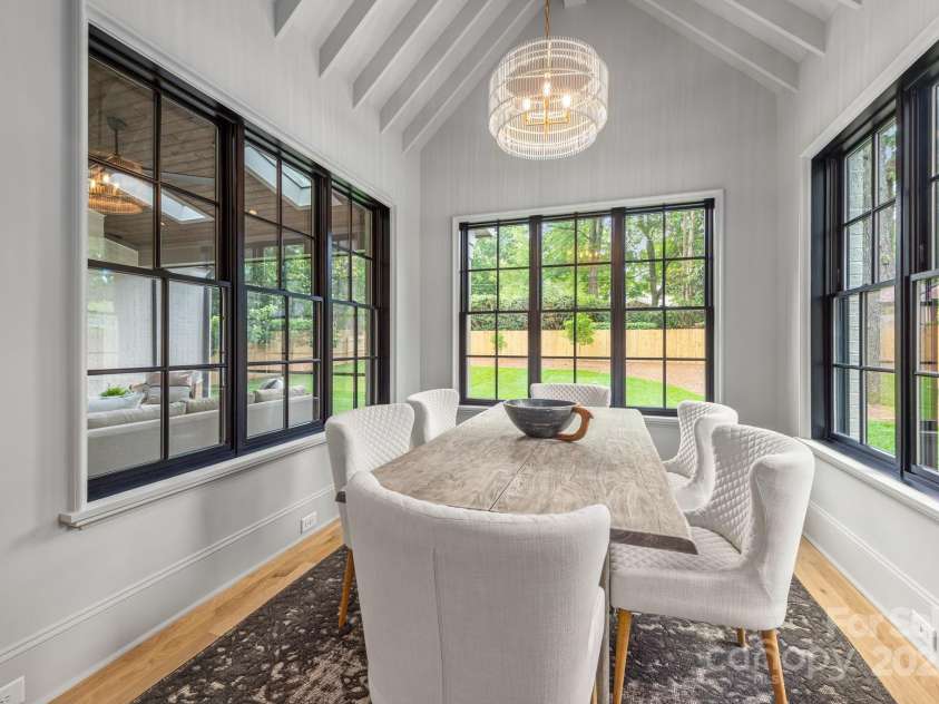 5124 Lansing Drive, Charlotte, NC 28270.  MLS# CAR4231364, YatesRealty ID 20951. Breakfast Room with vaulted ceiling and 3 walls of windows