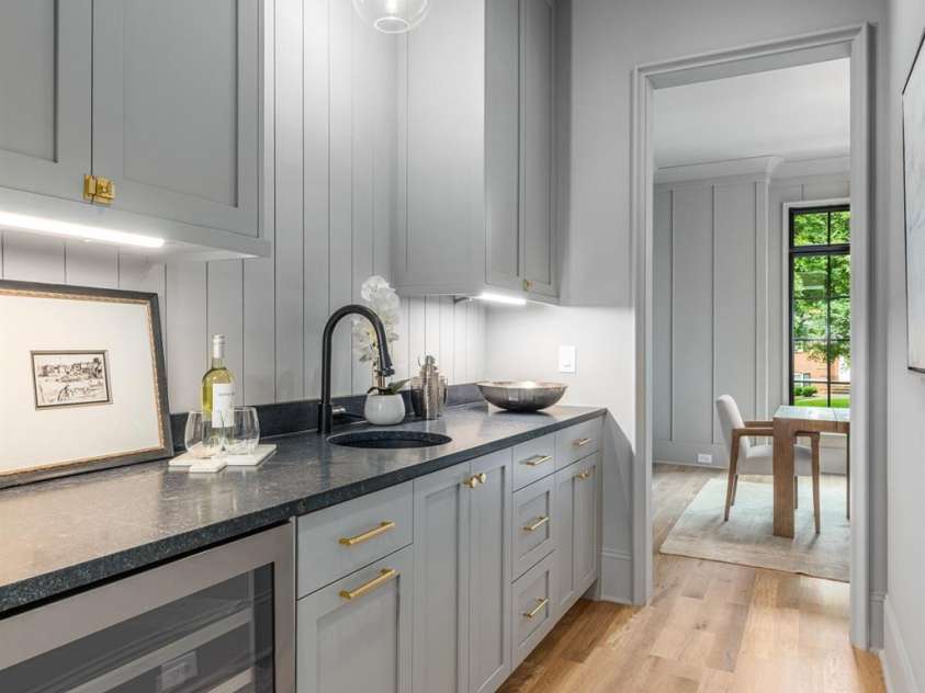 5124 Lansing Drive, Charlotte, NC 28270.  MLS# CAR4231364, YatesRealty ID 20951. Butler's Pantry with wine frig and lots of storage, perfect for entertaining!