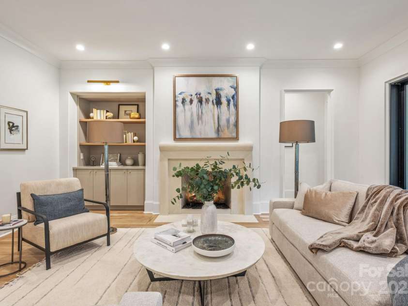 5124 Lansing Drive, Charlotte, NC 28270.  MLS# CAR4231364, YatesRealty ID 20951. Great Room with custom plaster fireplace mantle.