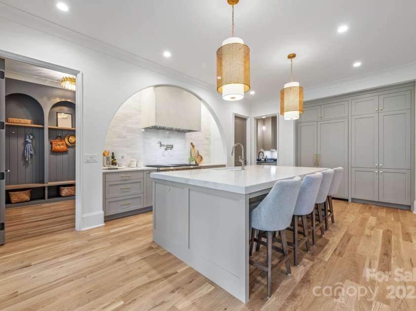 5124 Lansing Drive, Charlotte, NC 28270.  MLS# CAR4231364, YatesRealty ID 20951. Kitchen leads to the mudroom with custom built-ins and garage