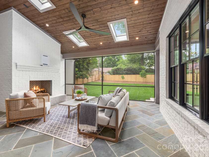 5124 Lansing Drive, Charlotte, NC 28270.  MLS# CAR4231364, YatesRealty ID 20951. Screen porch with fireplace.