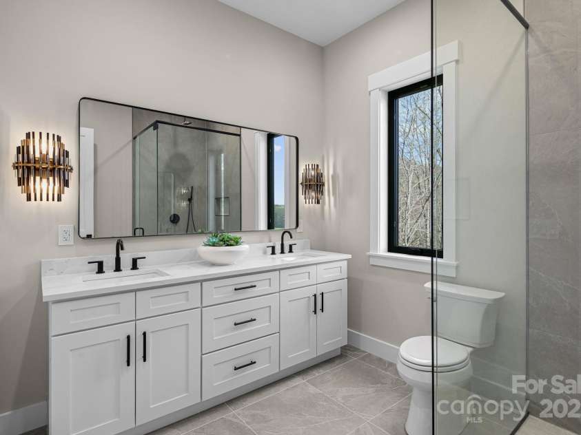 24 Slate Drive, Candler, NC 28715.  MLS# CAR4244090, YatesRealty ID 20953. Guest bath