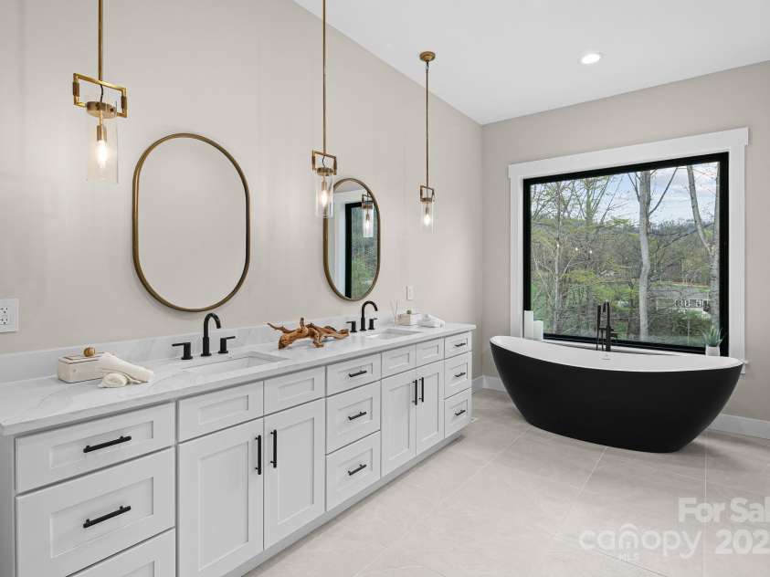 24 Slate Drive, Candler, NC 28715.  MLS# CAR4244090, YatesRealty ID 20953. Master bath
