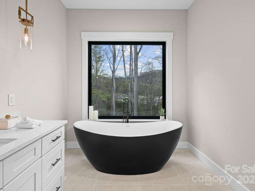 24 Slate Drive, Candler, NC 28715.  MLS# CAR4244090, YatesRealty ID 20953. Master bath