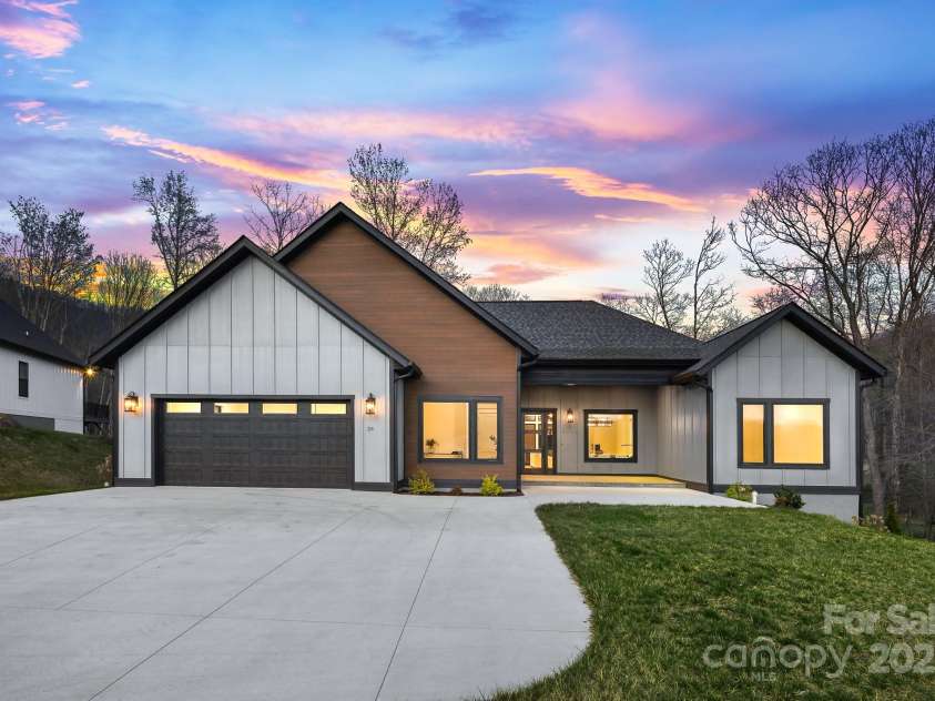 24 Slate Drive, Candler, NC 28715.  MLS# CAR4244090, YatesRealty ID 20953. Twilight front view