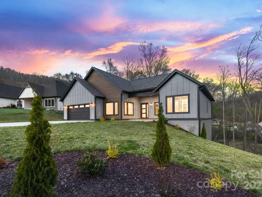 24 Slate Drive, Candler, NC 28715.  MLS# CAR4244090, YatesRealty ID 20953. Twilight front view